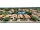 A picturesque neighborhood with tile roofed houses that are landscaped and surrounding a serene lake at 1558 W Maplewood St, Chandler, AZ 85286