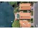 Aerial shot of lakefront homes, highlighting backyard pools, patios, and lush landscaping with easy access to the water at 1558 W Maplewood St, Chandler, AZ 85286