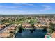 Lakefront community featuring a park with mature landscaping and luxurious homes with backyard pools at 1558 W Maplewood St, Chandler, AZ 85286