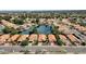 Aerial view of a community featuring waterfront homes, mature trees, and well-manicured lawns around a lake at 1558 W Maplewood St, Chandler, AZ 85286
