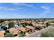 A neighborhood featuring waterfront homes, mature trees and desert landscaping surrounding a tranquil lake at 1558 W Maplewood St, Chandler, AZ 85286