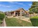 Inviting backyard featuring a covered patio, pool, and well-manicured lawn for outdoor enjoyment at 1558 W Maplewood St, Chandler, AZ 85286