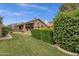 Expansive backyard with a lush lawn, mature trees, and private patio, ideal for outdoor relaxation at 1558 W Maplewood St, Chandler, AZ 85286