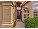 Inviting entryway with a stylish front door, flagstone walkway, and beautifully manicured greenery at 1558 W Maplewood St, Chandler, AZ 85286