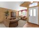 Inviting living area with natural light, classic furniture, and stylish terracotta-tiled flooring at 1558 W Maplewood St, Chandler, AZ 85286