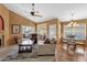 Comfortable living room with natural light, vaulted ceilings, and an adjacent dining area for seamless entertaining at 1558 W Maplewood St, Chandler, AZ 85286
