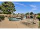 Lounge by the pool as you enjoy waterfront views from this relaxing backyard retreat at 1558 W Maplewood St, Chandler, AZ 85286
