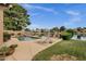 Resort-style pool and waterfront oasis with chaise lounges and tranquil pond views at 1558 W Maplewood St, Chandler, AZ 85286