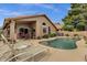Private backyard oasis featuring a refreshing pool, patio with lounge chairs, and lush landscaping at 1558 W Maplewood St, Chandler, AZ 85286