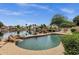 Beautiful pool and patio area overlooking a serene lake, perfect for relaxing and entertaining outdoors at 1558 W Maplewood St, Chandler, AZ 85286
