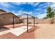 Backyard features a gazebo, mature trees, and low-maintenance desert landscaping at 15980 W Smokey Dr, Surprise, AZ 85374