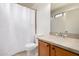 Bathroom featuring a toilet, shower with white curtain, and vanity with sink at 15980 W Smokey Dr, Surprise, AZ 85374