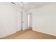 Bedroom with neutral carpet, light walls, and sliding closet doors at 15980 W Smokey Dr, Surprise, AZ 85374
