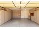 Neat garage boasts ample storage with custom cabinets, plus a convenient work station at 15980 W Smokey Dr, Surprise, AZ 85374
