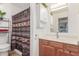 Functional bathroom with a shower, vanity, and storage cabinet, complemented by stylish decor at 16602 N 25Th St # 204, Phoenix, AZ 85032