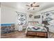 Serene bedroom with patterned bedding, desert-themed decor, and a ceiling fan for comfort at 16602 N 25Th St # 204, Phoenix, AZ 85032