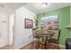Cozy dining area with decorative accents, warm green walls, and stylish desert-themed artwork at 16602 N 25Th St # 204, Phoenix, AZ 85032