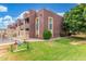 Exterior view of the building, showcasing well-maintained landscaping and a grassy area at 16602 N 25Th St # 204, Phoenix, AZ 85032