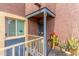 Charming front porch with desert-themed decor and a secure gated entrance to the property at 16602 N 25Th St # 204, Phoenix, AZ 85032