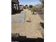 Spacious backyard area showcasing desert landscaping, a stone pathway, and rock features at 17111 S 180Th Ln, Goodyear, AZ 85338