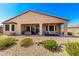 Inviting backyard featuring a covered patio, hot tub, and outdoor seating area at 17111 S 180Th Ln, Goodyear, AZ 85338