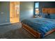 Cozy bedroom with plush carpeting and ensuite bathroom access at 17111 S 180Th Ln, Goodyear, AZ 85338