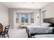 Bright bedroom with twin beds, a bay window, and neutral decor at 17111 S 180Th Ln, Goodyear, AZ 85338