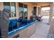 Outdoor hot tub on a covered patio with an inviting seating area at 17111 S 180Th Ln, Goodyear, AZ 85338