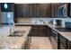 Modern kitchen featuring granite countertops, stainless steel appliances, and ample cabinet space at 17111 S 180Th Ln, Goodyear, AZ 85338