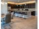 Modern kitchen featuring a large island with seating and pendant lighting at 17111 S 180Th Ln, Goodyear, AZ 85338