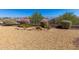 Attractive desert landscaping with rocks, bushes and other flora, creating a relaxing outdoor space at 17111 S 180Th Ln, Goodyear, AZ 85338