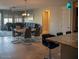 Open-concept living area with a dining table and comfortable seating, with sliding glass doors at 17111 S 180Th Ln, Goodyear, AZ 85338