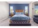 Charming main bedroom features a decorative blue accent wall and comfortable bedding at 17111 S 180Th Ln, Goodyear, AZ 85338
