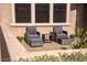 Inviting patio area with cushioned chairs and ottoman, ideal for enjoying outdoor living at 17111 S 180Th Ln, Goodyear, AZ 85338