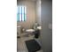 Stylish powder room with a pedestal sink and modern fixtures at 17111 S 180Th Ln, Goodyear, AZ 85338