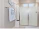 Clean shower features white tiles, glass doors, and a convenient built-in seat at 17111 S 180Th Ln, Goodyear, AZ 85338