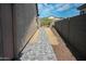 Side yard is landscaped with rock and a paved walkway at 17111 S 180Th Ln, Goodyear, AZ 85338