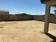 Spacious backyard with a concrete perimeter, offering ample space for landscaping and outdoor activities at 17245 W Corrine Dr, Surprise, AZ 85388