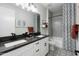 Chic bathroom featuring double sinks, elegant fixtures, and a tub shower combination at 17245 W Corrine Dr, Surprise, AZ 85388