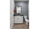 Stylish half-bathroom with modern fixtures and tiled wall at 17245 W Corrine Dr, Surprise, AZ 85388