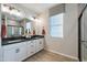 Modern bathroom with dual sinks, sleek countertops, and a stylish shower at 17245 W Corrine Dr, Surprise, AZ 85388