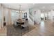 Inviting dining area with stylish chandelier and staircase at 17245 W Corrine Dr, Surprise, AZ 85388