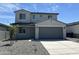 Charming two-story home with a two-car garage, a well-manicured lawn, and inviting curb appeal at 17245 W Corrine Dr, Surprise, AZ 85388