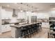Bright and airy kitchen featuring a large island, white cabinetry, stainless steel appliances, and open layout at 17245 W Corrine Dr, Surprise, AZ 85388