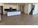 Open kitchen with sleek finishes and a view of the staircase at 17245 W Corrine Dr, Surprise, AZ 85388