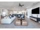 Inviting living room showcasing contemporary furniture, plush seating, and a neutral color palette at 17245 W Corrine Dr, Surprise, AZ 85388