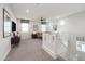 Cozy upstairs loft with comfortable seating, a TV, and plenty of natural light at 17245 W Corrine Dr, Surprise, AZ 85388