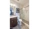 Bathroom with a modern vanity, toilet, and a glass enclosed shower featuring decorative tile at 17312 W Dahlia Dr, Surprise, AZ 85388