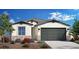 Charming single-Gathering home featuring a neutral palette, stone accents, two-car garage, and manicured landscaping at 17312 W Dahlia Dr, Surprise, AZ 85388