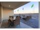 Outdoor patio with dining table, lounge chairs, and fire pit, perfect for entertaining at 17312 W Dahlia Dr, Surprise, AZ 85388